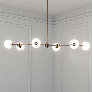 Lustre Alycia en métal peint laiton mat et sphères en verre blanc mat 120 x 68 cm. hauteur 90-150 cm